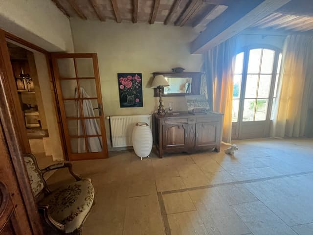 Entry with paintings and antique furniture