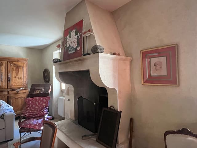 Fireplace wall with framed artwork